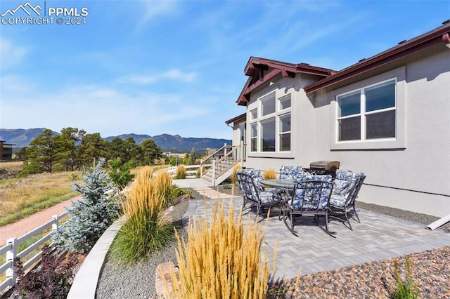 view of patio / terrace with a mountain view