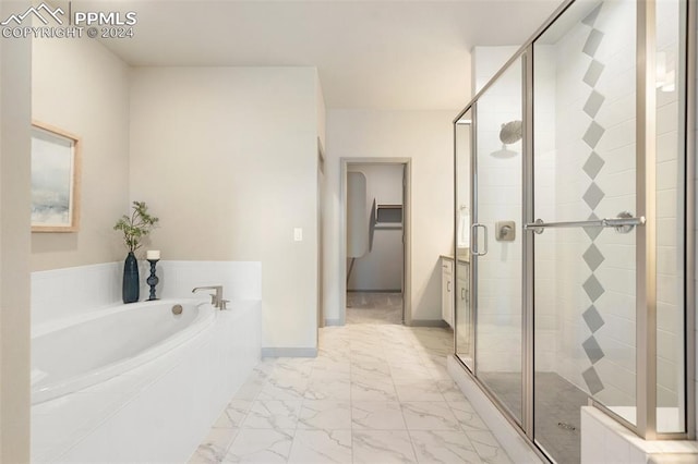 bathroom with separate shower and tub