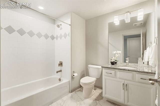 full bathroom with vanity, toilet, and tiled shower / bath combo