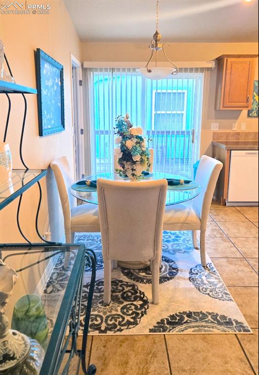 dining area featuring light tile patterned floors