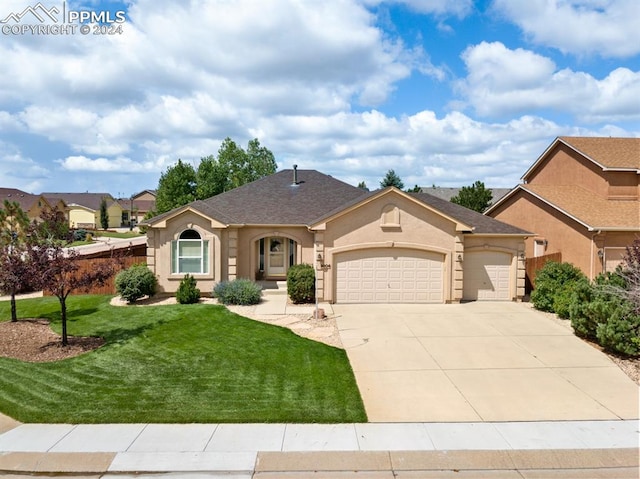 ranch-style home featuring a front lawn and a garage