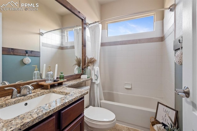 full bathroom with shower / bathtub combination with curtain, vanity, and toilet