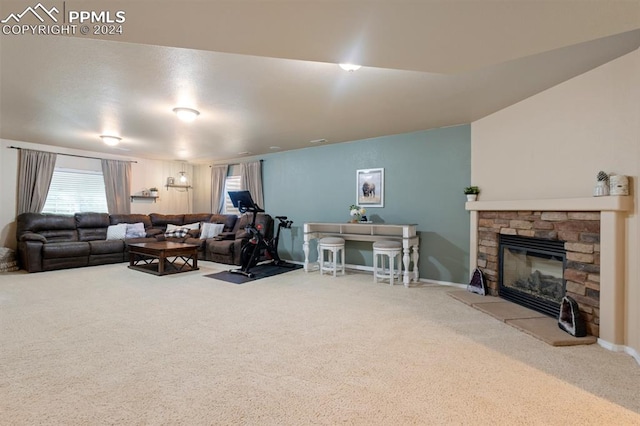 living room with a fireplace and carpet