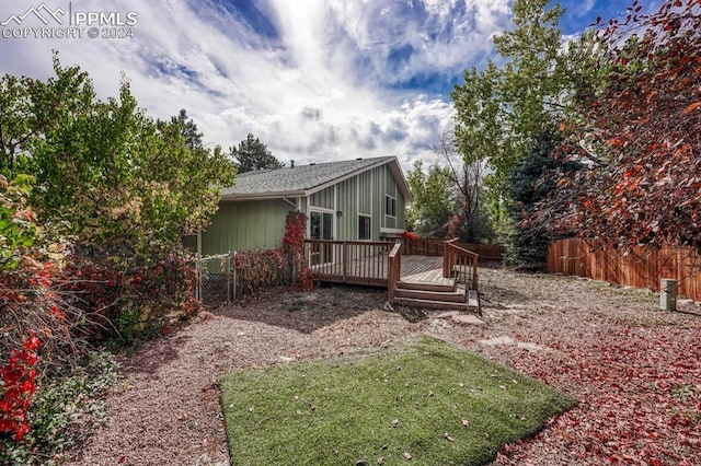 view of yard featuring a wooden deck