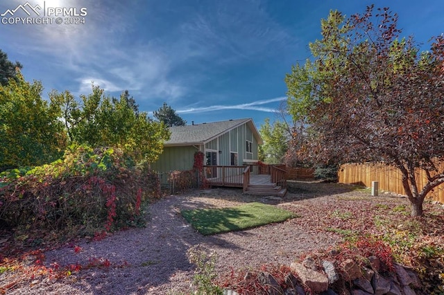 view of side of property with a wooden deck