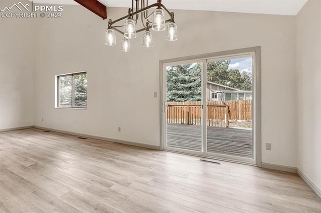 unfurnished dining area with light hardwood / wood-style floors, beamed ceiling, high vaulted ceiling, and an inviting chandelier