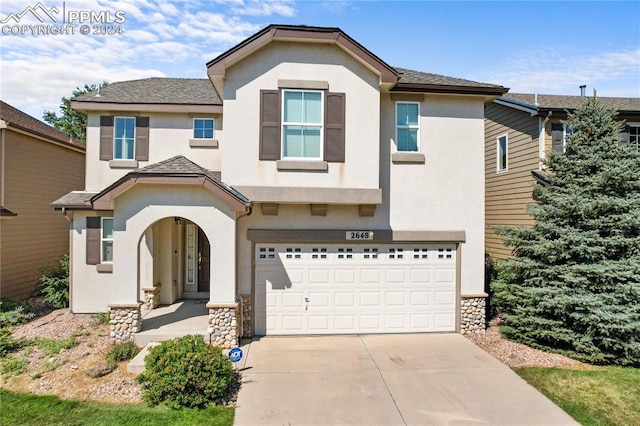 view of front of property with a garage