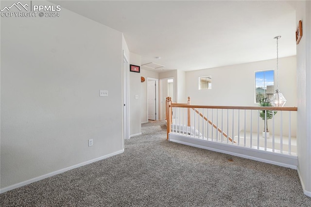 unfurnished room featuring carpet flooring