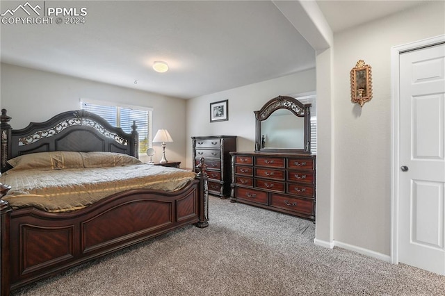 bedroom with light colored carpet