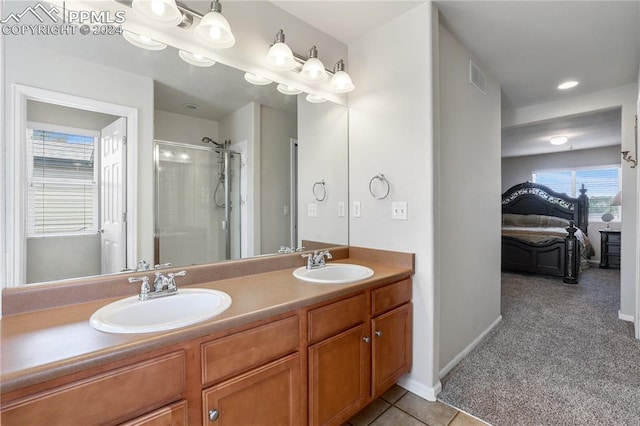 bathroom with vanity, tile patterned flooring, and walk in shower