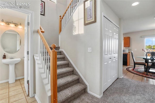 staircase with tile patterned flooring