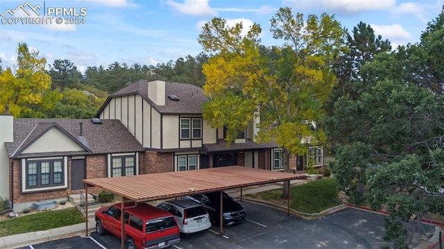 tudor house featuring a carport