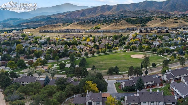 birds eye view of property with a mountain view