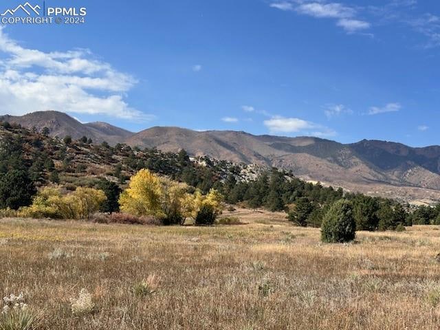 view of mountain feature with a rural view