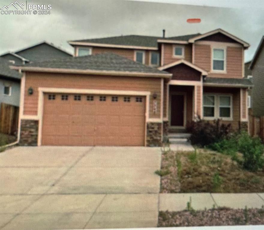 craftsman-style house featuring a garage