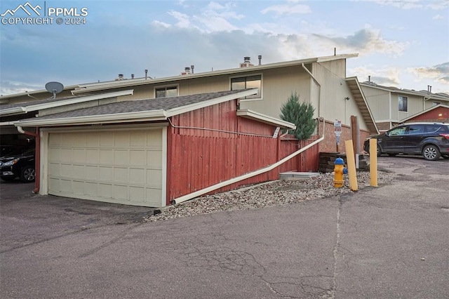 view of property exterior with a garage