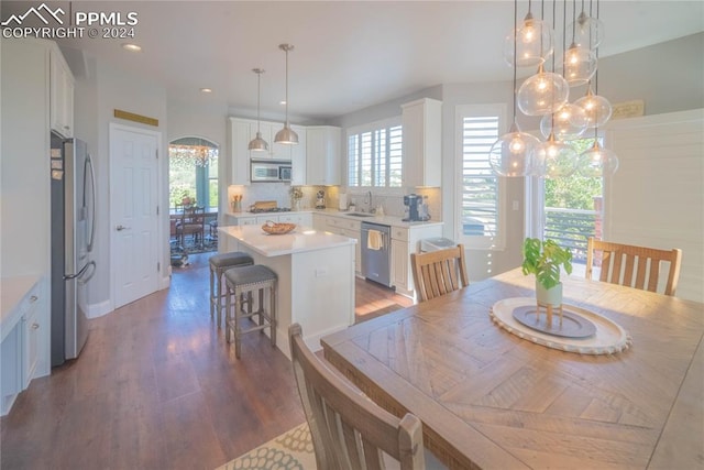 dining room featuring hardwood / wood-style floors and sink