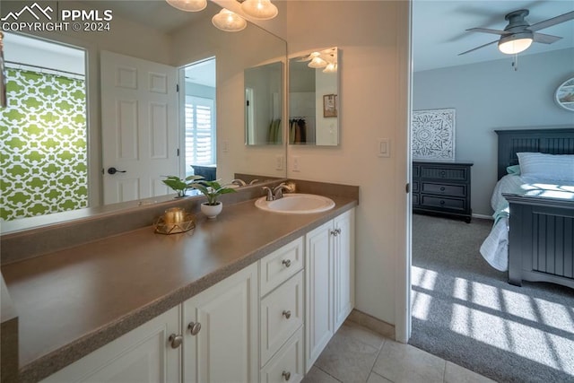 bathroom featuring ceiling fan, vanity, and tile patterned floors