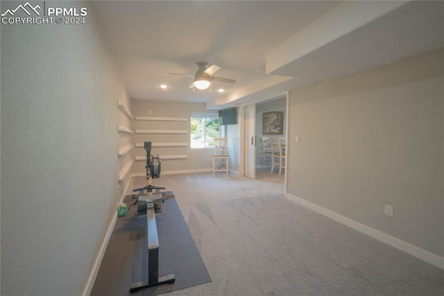 workout room with carpet flooring and ceiling fan