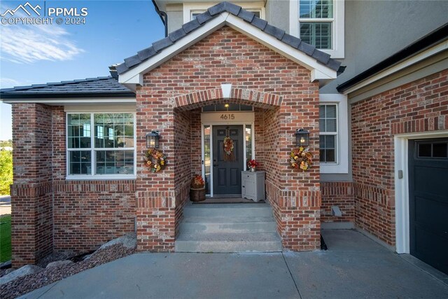 property entrance featuring a garage