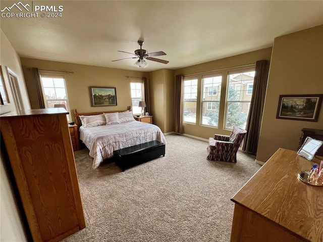 carpeted bedroom featuring ceiling fan