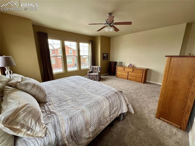 bedroom with ceiling fan and carpet