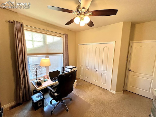 office area featuring light carpet, plenty of natural light, and ceiling fan