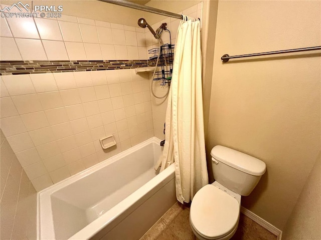 bathroom featuring toilet, tile patterned floors, and shower / tub combo with curtain