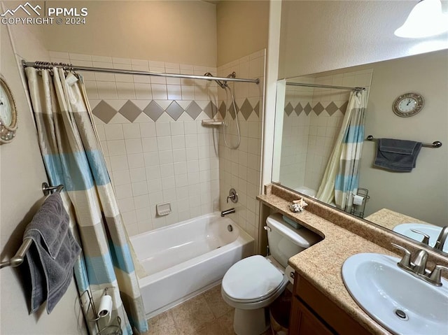 full bathroom with tile patterned floors, vanity, toilet, and shower / bath combo with shower curtain