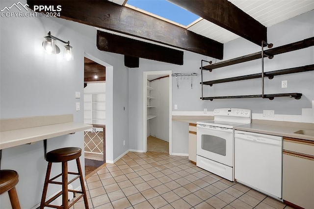 kitchen featuring light tile patterned flooring, beam ceiling, white appliances, and white cabinets