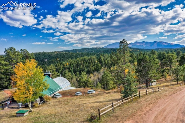 drone / aerial view featuring a rural view and a mountain view