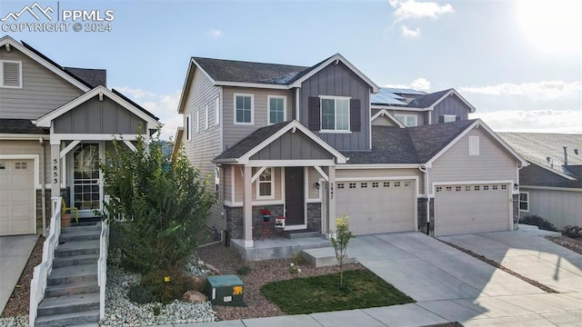 craftsman inspired home featuring covered porch and a garage