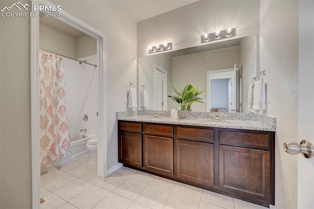 full bathroom featuring shower / bath combo with shower curtain, vanity, toilet, and tile patterned flooring