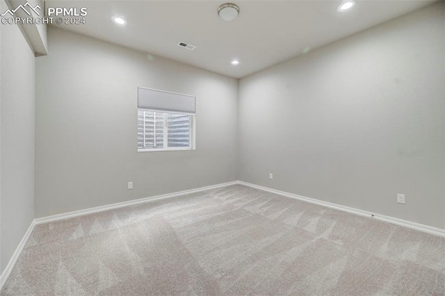 empty room featuring light colored carpet