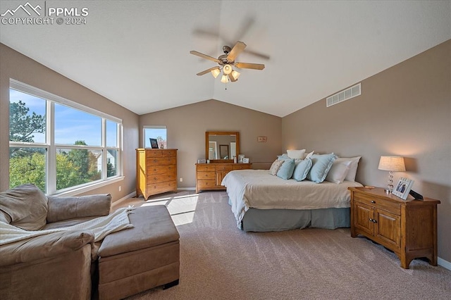 bedroom with lofted ceiling, light colored carpet, and ceiling fan