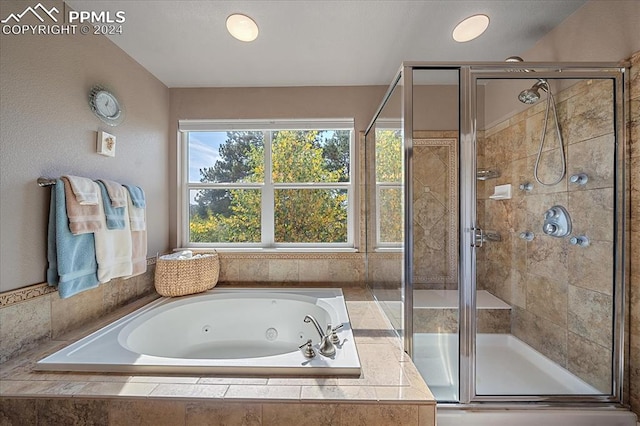 bathroom featuring plus walk in shower