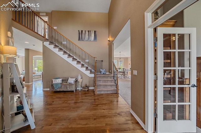 entrance foyer with hardwood / wood-style flooring and a healthy amount of sunlight