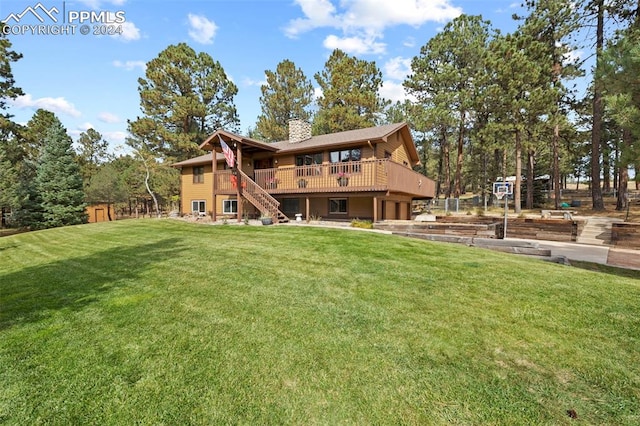 10760 Hardy Rd, Colorado Springs, CO 80908 - rear view of property featuring a chimney, stairway, a deck, and a lawn