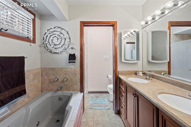 10760 Hardy Rd, Colorado Springs, CO 80908 - full bath with a jetted tub, a sink, double vanity, and toilet