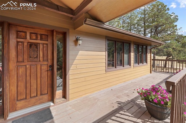 10760 Hardy Rd, Colorado Springs, CO 80908 - entrance to property featuring a deck