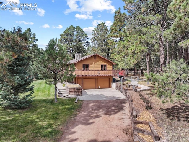 10760 Hardy Rd, Colorado Springs, CO 80908 - view of front of property featuring a front yard, an attached garage, a chimney, and aphalt driveway