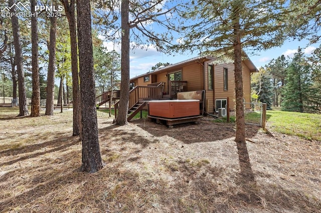 10760 Hardy Rd, Colorado Springs, CO 80908 - view of yard featuring stairway, a wooden deck, and a hot tub