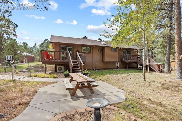 10760 Hardy Rd, Colorado Springs, CO 80908 - back of property featuring a gate, a wooden deck, a patio, and stairs