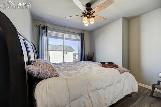 bedroom featuring ceiling fan and dark hardwood / wood-style floors