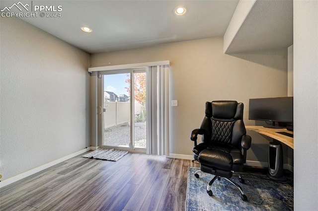 home office with hardwood / wood-style flooring