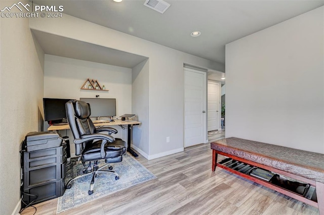 office with light hardwood / wood-style floors