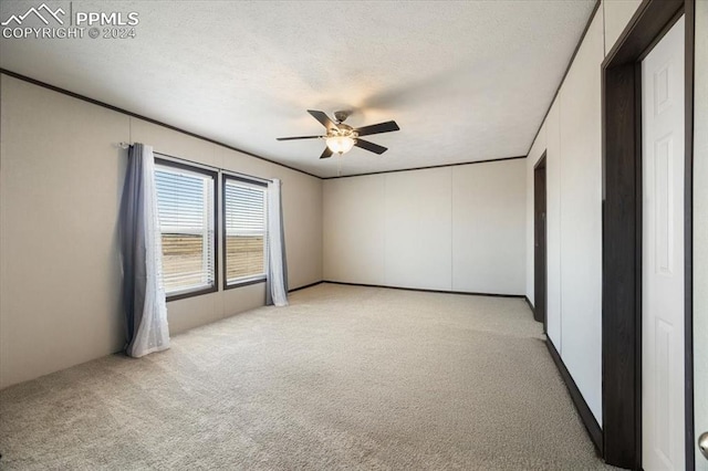 6652 Middlefield Ct, Colorado Springs, CO 80928 - empty room featuring light colored carpet, ceiling fan, and a textured ceiling