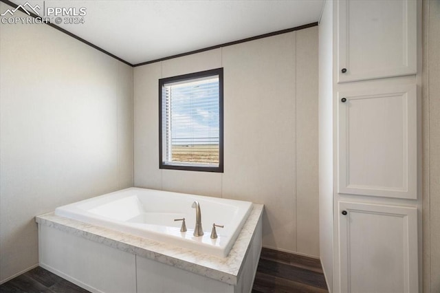 6652 Middlefield Ct, Colorado Springs, CO 80928 - bathroom featuring wood finished floors, a garden tub, and crown molding