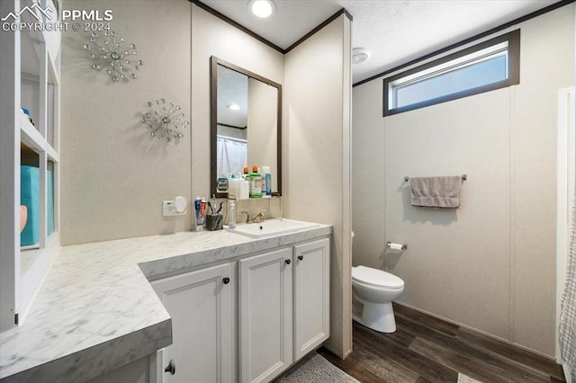 6652 Middlefield Ct, Colorado Springs, CO 80928 - bathroom with wood finished floors, toilet, and vanity
