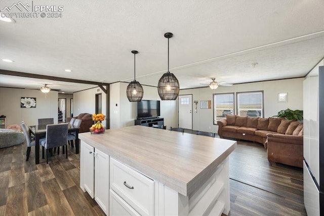 6652 Middlefield Ct, Colorado Springs, CO 80928 - kitchen with open floor plan, ceiling fan, dark wood finished floors, white cabinets, and recessed lighting